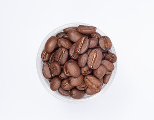 Bean coffee in white background. Medium roasted coffee beans are light brown in color in white background.