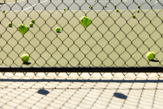 Tennis balls through the fence