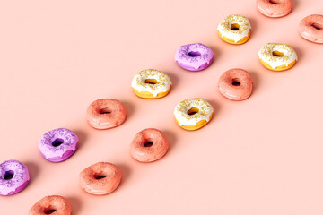 Colorful donuts crossing the frame with copy space