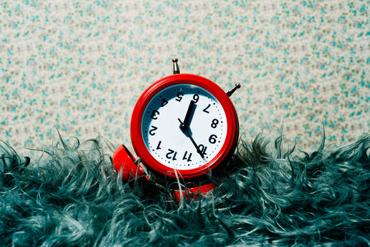 red alarm clock upside down