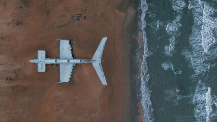 overhead view of a military plane on the seacoast