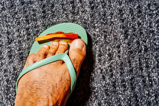 french frie with ketchup on a flip-flop