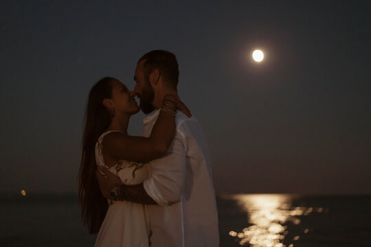 Couple kissing in the moonlight