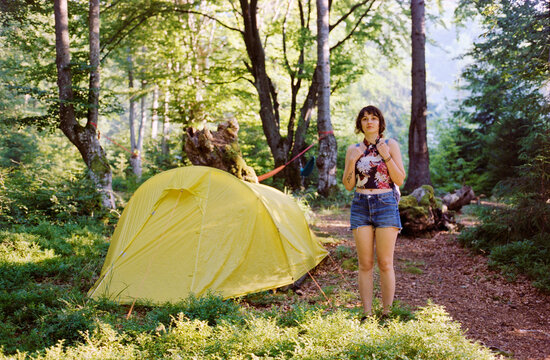 Woman standing near the tent 
