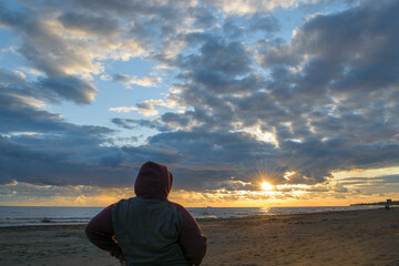 person watching the sunset