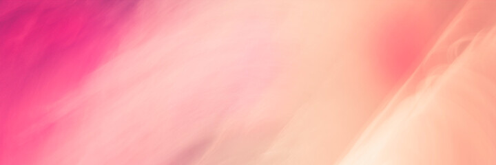 Coral pink and rose-colored seascape of motion blur photography from aerial view. Soft pastel-toned abstract textures of sea waves.