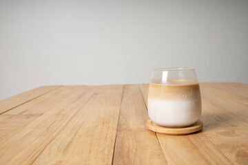 cold latte coffee glass on wood table copy space background