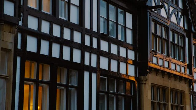 Close-up view of iconic black-and-white timber-framed houses in Chester, Cheshire, England, UK, typical of the Tudor era