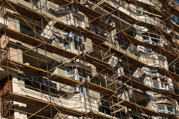scaffolding at the wall of a multi-storey building