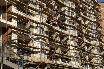 scaffolding at the wall of a multi-storey building