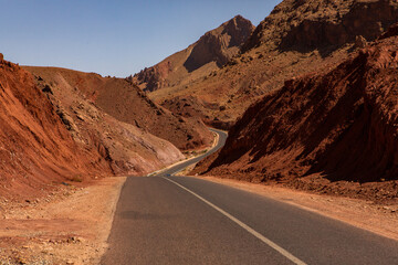 The asphalt road through the Sahara desert in Morocco, Africa