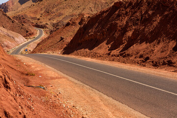 The asphalt road through the Sahara desert in Morocco, Africa