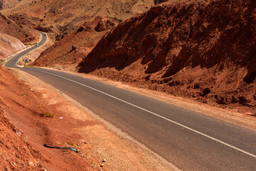 The asphalt road through the Sahara desert in Morocco, Africa