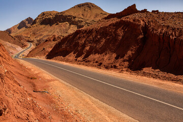 The asphalt road through the Sahara desert in Morocco, Africa