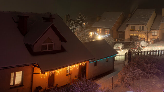 Street covered in fresh snow. A calm neighborhood during christmass time. Germany, suburbs of Berlin