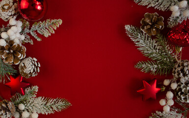 red background,Christmas tree branches, cones. festive. new year