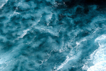 Aerial view to seething waves with foam. Waves of the sea meet each other during high tide and low tide - 463761128