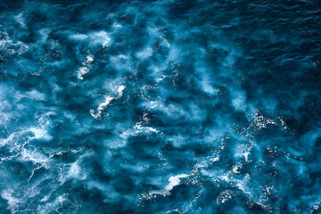 Aerial view to seething waves with foam. Waves of the sea meet each other during high tide and low tide - 463761130