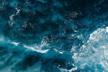 Aerial view to seething waves with foam. Waves of the sea meet each other during high tide and low tide - 463761131