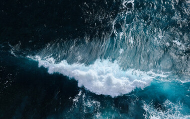 Aerial view to seething waves with foam. Waves of the sea meet each other during high tide and low tide - 463761132