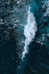 Aerial view to seething waves with foam. Waves of the sea meet each other during high tide and low tide - 463761133