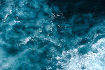 Aerial view to seething waves with foam. Waves of the sea meet each other during high tide and low tide - 463761136