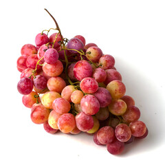 a brush of table pink grapes on a white background