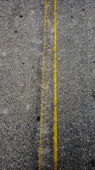 Fototapeta premium yellow line on asphalt