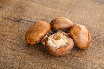 Raw brown champignons mushroom heap