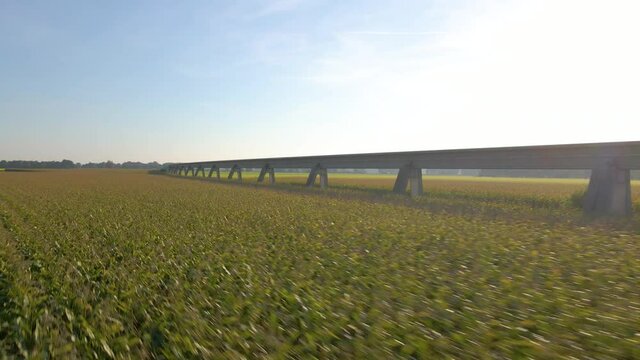 Low Aerial Over Green Fields With Maglev Transrapid Test Track In Lathen, Germany. Drone