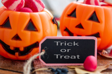 wishing happy halloween text on a label with pumpkins background