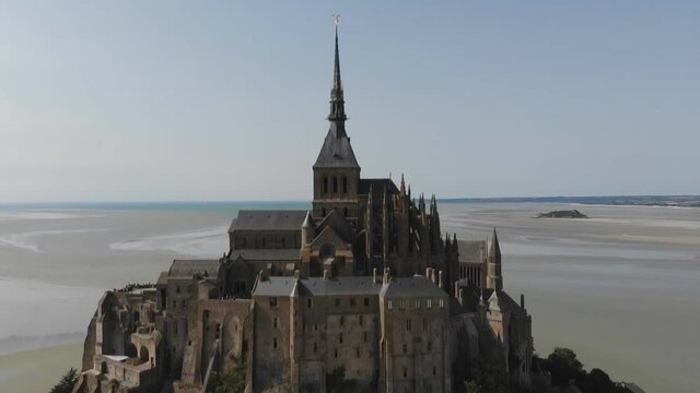 Mont St Michel touristic attraction of northern France in retro style - Famous historic place of French culture retro shoot (aerial photography)