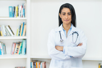 Serious mexican female doctor with copy space
