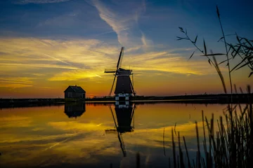 Foto auf Alu-Dibond Molen van het Noorden op Texel bij zonsondergang © W