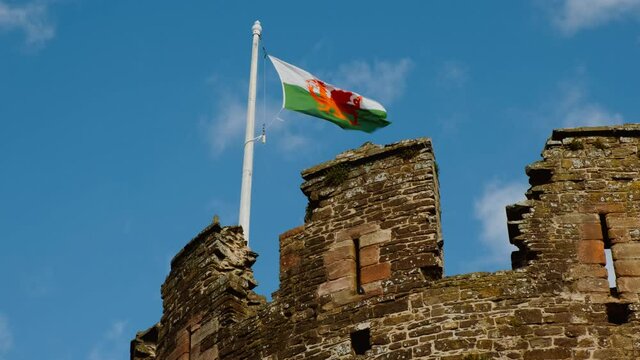 The Welsh flag flies at Conwy Castle, in North Wales, UK, built by Edward I, during his conquest of Wales, between 1283 and 1289