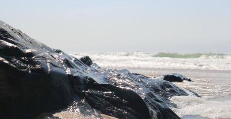 close - up soft and foamy wave of the sea