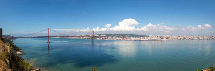 Lisbon Portugal bridge Ponte 25 de Abril over Tejo river panorama town travel