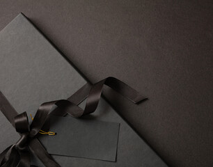 Black Friday sale concept, Gift box with ribbon bow on black background