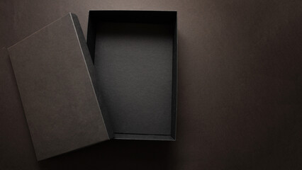 Black Friday sale advertising and branding concept, Gift box black open cover against dark background