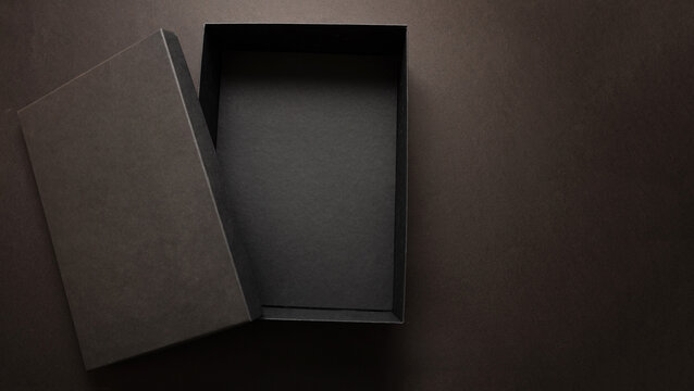 Black Friday sale advertising and branding concept, Gift box black open cover against dark background