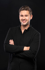 Portrait of smiling handsome man posing in studio