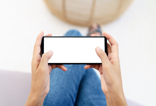 Hand Using Cell Phone In Horizontal White Screen Display