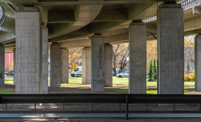 A sunny autum day in a city under the highway