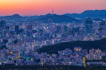 Seoul city night view from the top of the mountain at sunset time