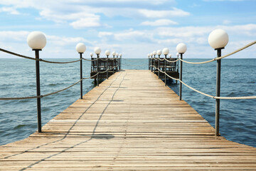 Beautiful river scene with wooden pier on sunny day