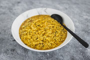 vegan curry rice with coriander seeds and chilli flakes, healthy plant-based food