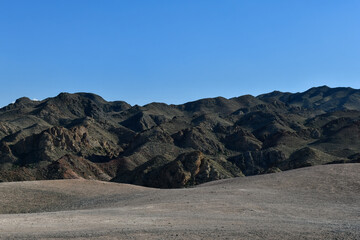 Mountain texture and blue sky, space for text