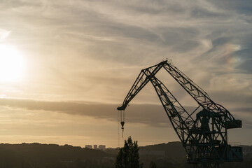Gdansk, Poland. 2021 Old shipbuilding company. Cranes for the construction of boats. On the Sunset.