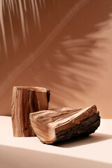 Natural wood podium with tropical leaves shadow in the background. Beautiful background from...