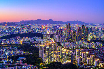 Seoul city night view from the top of the mountain at sunset time